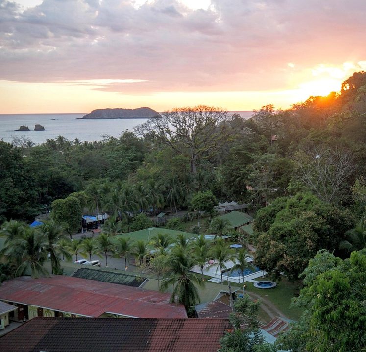 Eco-Lodge in Harmony with Nature. Aerial view of an eco-lodge immersed in nature, designed for sustainable living, low-impact tourism, and lasting environmental balance.